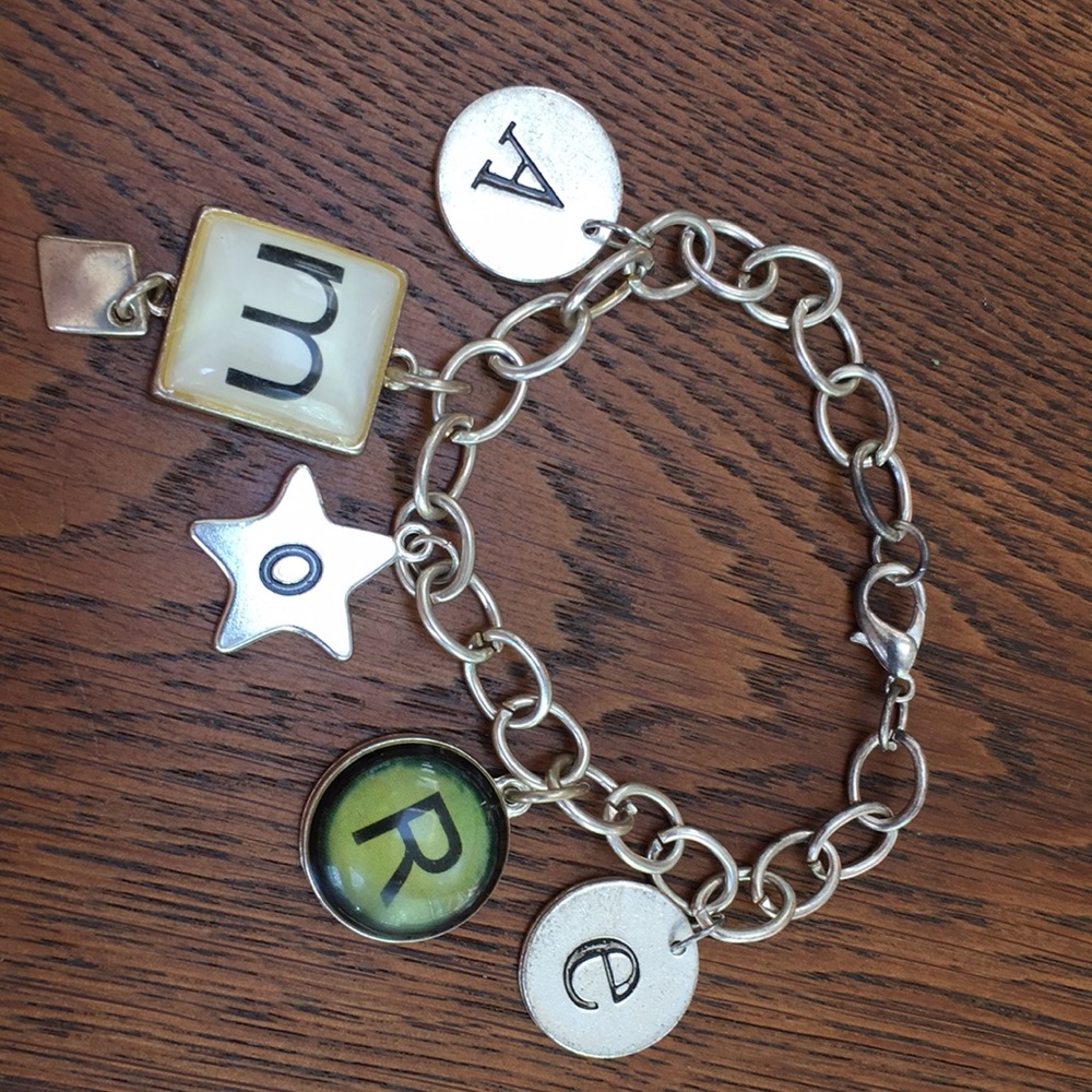 LOVE bracelet. AMORE=love. Mixed stamped letters w/ simulated typewriter keys.
